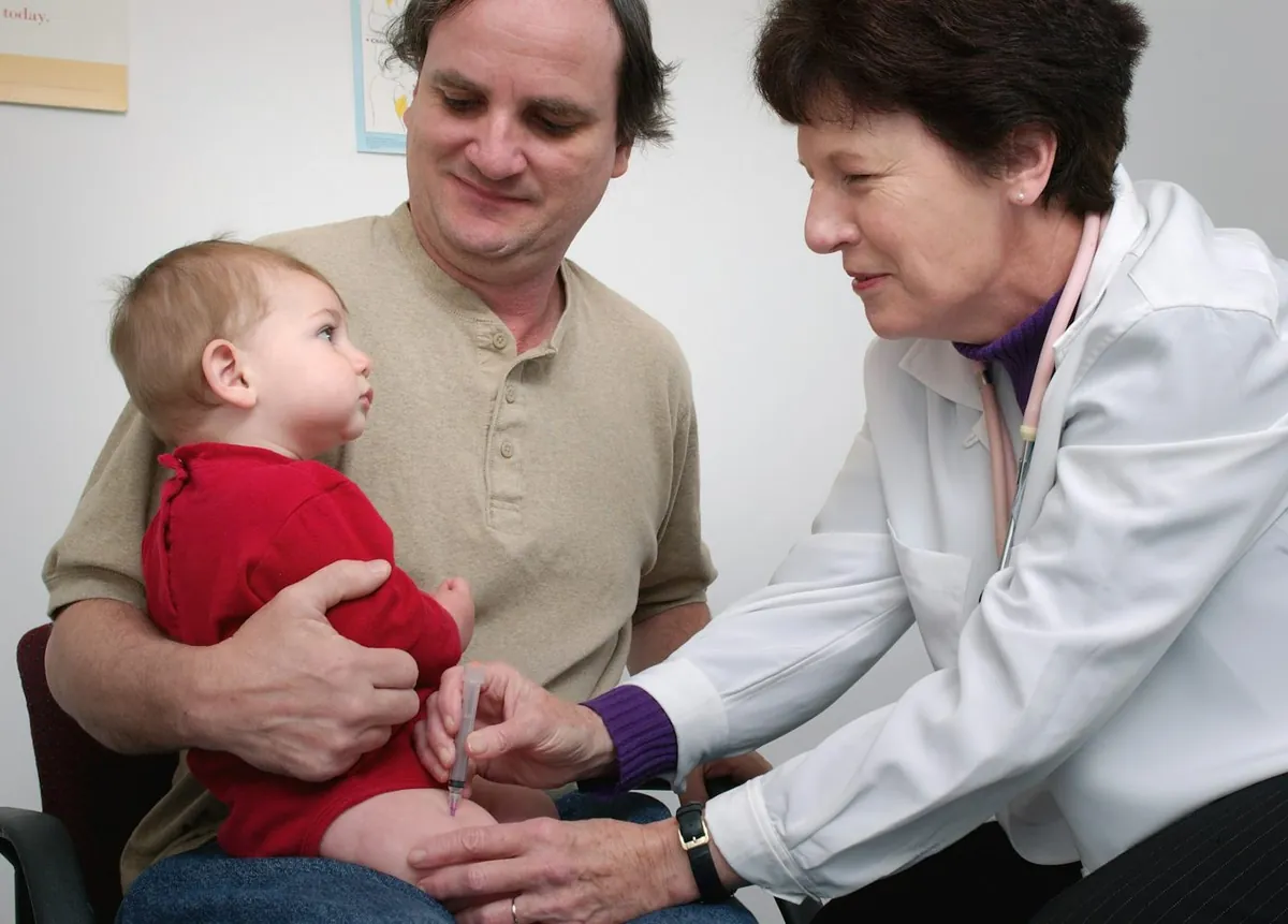 Pediatric doctor examining a child in consultation