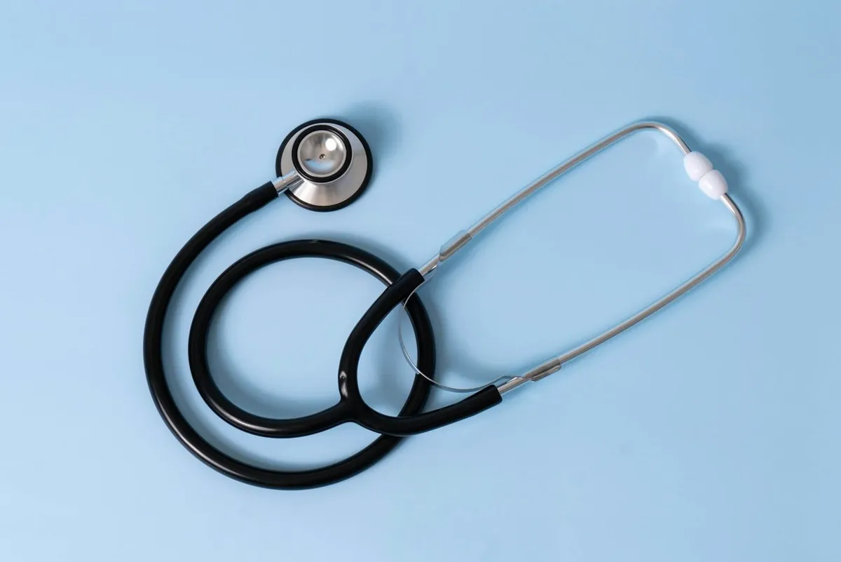 Pediatrician gently examining an infant with a stethoscope